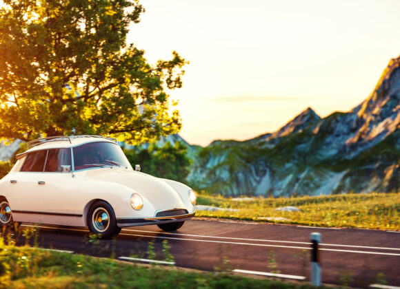 When Queens Ride By Cute little retro car goes by wonderful countryside road at sunset