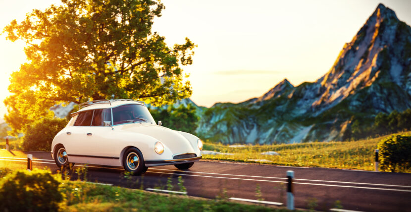 When Queens Ride By Cute little retro car goes by wonderful countryside road at sunset